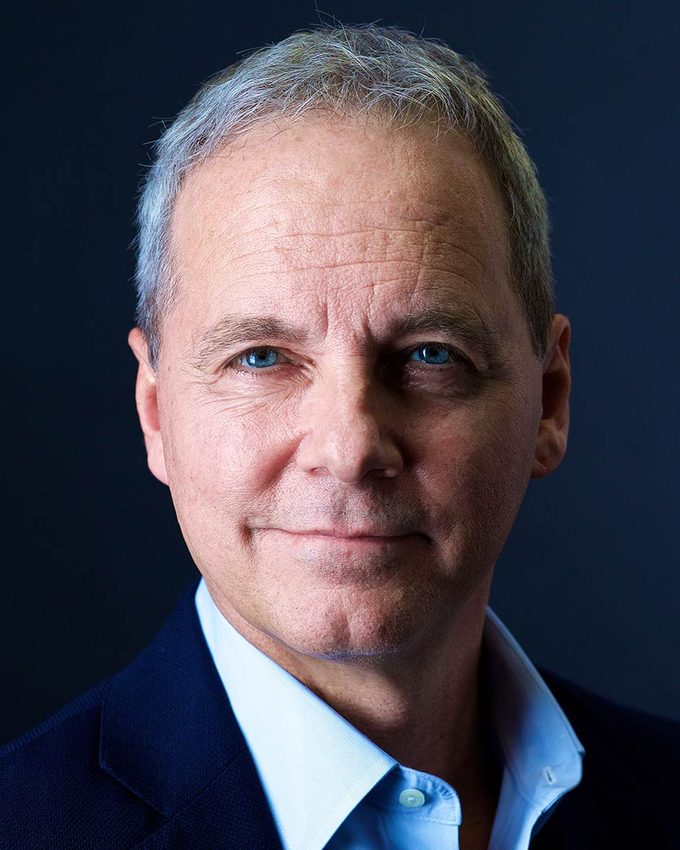 Corporate headshot on a black background, NYC
